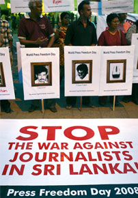 Sri Lankan journalists hold portraits of slain colleagues. (AP)
