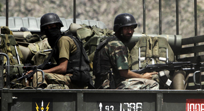 Pakistani soldiers on their way to Buner. (AP/Mohammad Sajja)