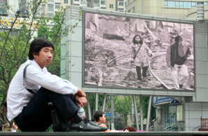 A public screen in Shanghai shows a program marking the anniversary of the Sichuan earthquake. (AP/Eugene Hoshiko)