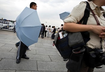 Umbrella censors in Tiananmen Square on June 4. (AP)