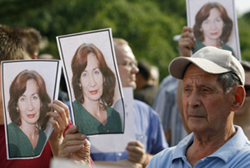 Supporters hold photos of Estemirova at a remembrance in Moscow. (Reuters/Denis Sinyakov)