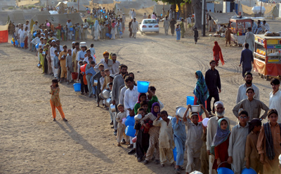 Fighting displaced hundreds of thousands, including these people at a makeshift camp in Swabi. (AFP)