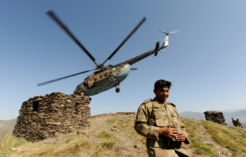A military helicopter brings reporters to the Swat valley. (AP)