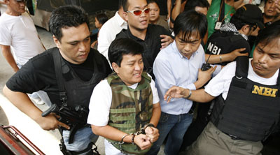 Andal Ampatuan Jr., a defendant in the killings, is taken to court in Manila. (Reuters/Roi Azure)