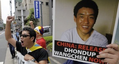 Demonstrators demand the release of documentary filmmaker Dhondup Wangchen, jailed in China after interviewing Tibetans. (AFP)