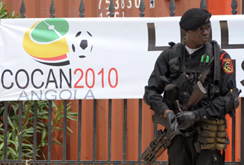A soldier stands guard before an African Nations Cup banner. (AFP)
