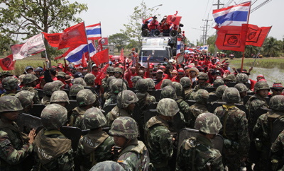 Troops confront protesters in Bangkok. (Reuters/Sukree Sukplang)