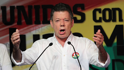 The government barred some news coverage of the first round of voting, won by Juan Manuel Santos. (AP/Fernando Vergara)