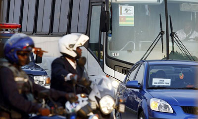 Angolan police escort the Togolese team bus in the aftermath of the deadly attack. (Reuters/Amr Abdallah Dalsh)
