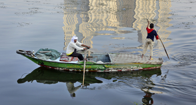 Fishermen on the Nile, where chemical dumping has been reported. (AP/Ben Curtis)