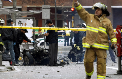 Emergency workers at the blast scene. (AP/William Fernando Martinez)