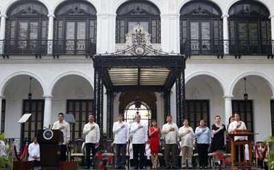 President Aquino, here with his cabinet at Malacañang Palace, has frankly addressed issues like impunity and journalists' rights. (Reuters/Romeo Ranoco)