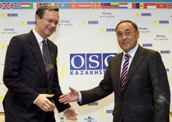 Foreign Minister Saudabayev, right, with OSCE Secretary-General Marc Perrin de Brichambaut, outlined an agenda free of human rights issues.(Reuters/Shamil Zhumatov)