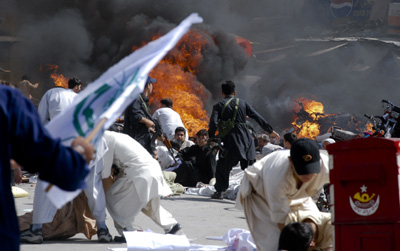 Mayhem follows a suicide bombing in Quetta. (AP/Arshad Butt)
