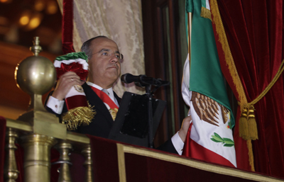 Calderón, seen here at recent Independence Day celebrations, says he is "pained" by anti-press violence in Mexico. (AP/Dario Lopez-Mills)