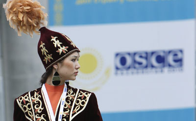A performer in traditional Kazakh clothing at a recent OSCE ministerial meeting. (Reuters/Pavel Mikheev)