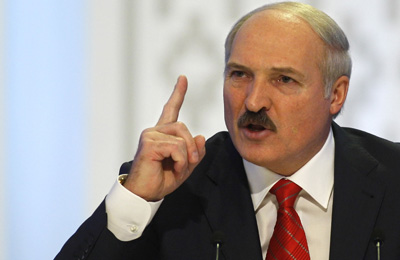 Belarusian President Aleksandr Lukashenko speaks in Minsk on December 20, the same day riot police forcibly dispersed thousands of demonstrators protesting the results of a flawed presidential vote. (AP/Sergei Grits)