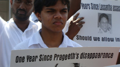 The son of missing cartoonist Prageeth Eknelygoda seeks justice at a Colombo rally. (Paba Deshapriya)