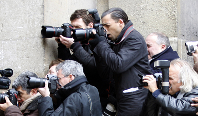 Dolega, center standing, is seen on assignment in 2008. He died from head injuries suffered while covering street protests in Tunis. (Reuters/Charles Platiau)