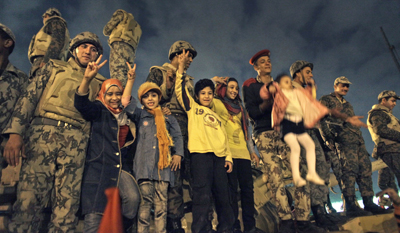 Soldiers and children celebrate in Tahrir Square. (AP/Ben Curtis)