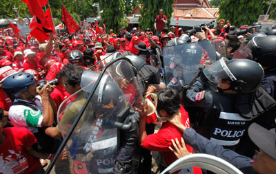 With journalists in their midst, police and protesters clash in Bangkok. (Reuters/Chaiwat Subprasom)