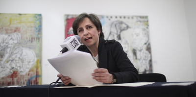 Mexican journalist Carmen Aristegui tells the media today she was fired from MVS for refusing to apologize for comments last week on her radio show. (AP/Alexandre Meneghini)