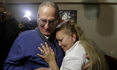 Freed journalist Héctor Maseda Gutiérrez embraces his wife, Laura Pollán, leader of Cuban dissident group Ladies in White, in his home in Havana. (AP/Franklin Reyes)