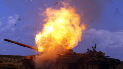 An airstrike targets a tank belonging to Qaddafi forces near Benghazi. (Reuters/Goran Tomasevic)