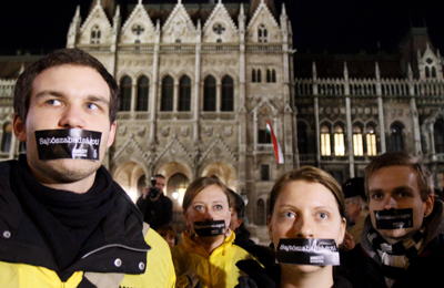 Hungarians protest the country's new media law outside parliament. (Bernadett Szabo/Reuters)