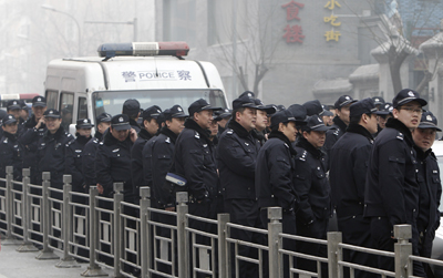Chinese police stand guard near a planned protest site for the "Jasmine Revolution" on February 20 in Beijing. (AP/Andy Wong)