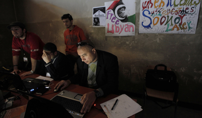 Libyan uprising activists set up a media center headquarters in Benghazi that provides technical support to journalists, documents collected media material, and communicates with foreign media. (AP/Nasser Nasser)