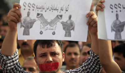 Protesters denounce anti-press violence in Iraqi Kurdisatn in this 2010 demonstration. (AP/Yahya Ahmed)