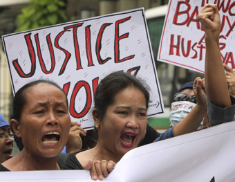 In the Philippines, relatives of the Maguindanao victims fear the prosecution will fail. (AP/Pat Roque)