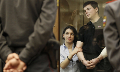 In a notorious double-murder, a life prison term for gunman Nikita Tikhonov, right, and 18 years for accomplice Yevgeniya Khasis.(AP/Ivan Sekretarev)