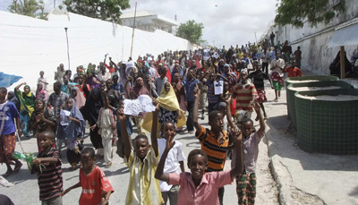 Somali protesters march in Mogadishu, taking to the streets for a second day. (AP/Farah Abdi Warsameh)