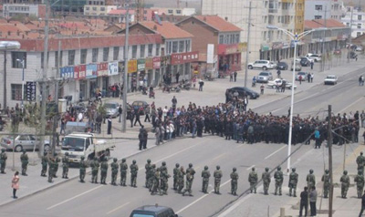 Paramilitary police block the street during a protest in Xilinhot, Inner Mongolia. (Reuters/Southern Mongolian Human Rights Information Center/Handout)