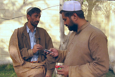 Syed Saleem Shahzad, right, with Pakistani journalist Qamar Yousafzai at the Afghan border in 2006 after being released by the Taliban. (AP)