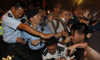 Police in Hong Kong crack down on a pro-democracy protest--and journalists who tried to cover the event. (Reuters/Tyrone Siu)