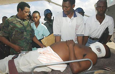 Pierre Elisem was shot by Aristide supporters in Port-au-Prince in February 2004. (AP/Walter Astrada)