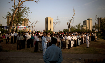 Pakistani journalists offer funeral prayers for their slain colleague Saleem Shahzad in June. (AP/B.K.Bangash)