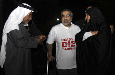 Abduljalil Alsingace, center, stands with his family after being released from prison in February. (AP)