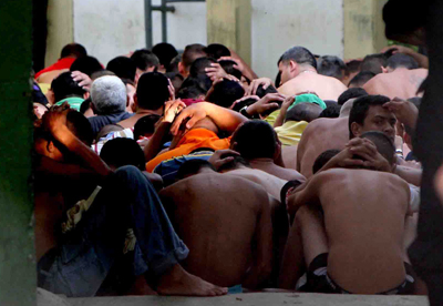 Inmates are subdued after a prison riot in Cabimas, Venezuela. Globovisión was fined more than US$2 million for its coverage of the uprising. (AP)