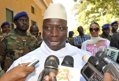 Gambian President Yahya Jammeh speaks to reporters as he leaves a polling station in Banjul November 24. (AFP)