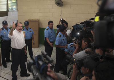 The media strategy of Nicaraguan President Daniel Ortega, shown after casting his ballot in Sunday's election, is to ignore journalists. (AP)