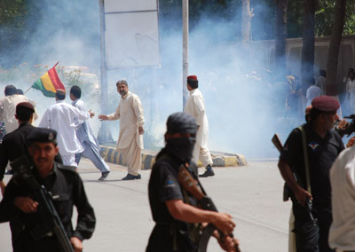 Pakistani police and supporters of the Baluchistan National Party clash in Quetta, Pakistan on July 14, 2010. (AP)