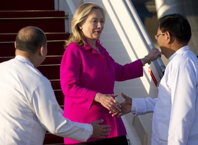 U.S. Secretary of State Hillary Clinto is greeted by Myanmar Deputy Foreign Minister Myo Myint, right, upon her arrival in Naypyidaw, Myanmar, Wednesday. (AP)