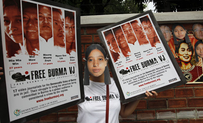 In Bangkok, a protester calls on Burma to free Hla Hla Win and three other imprisoned video reporters for the Democratic Voice of Burma. (Reuters)