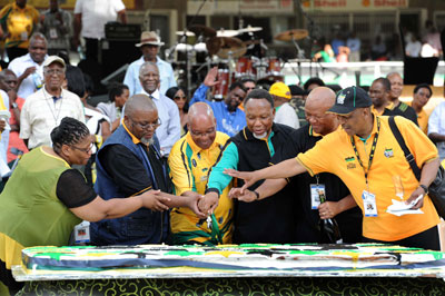 South African President Jacob Zuma, center, and other members of the ANC cut a cake celebrating the 100th year of the party. (EPA/Elmond Jiyane)