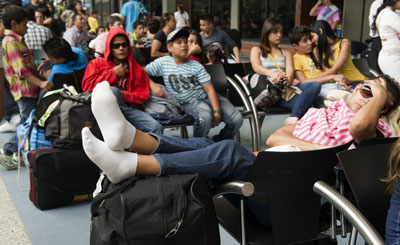 People remain stranded at the North Bus Terminal in Medellin, Antioquia department, on January 5, 2012 during an armed strike imposed by the criminal gang Los Urabeños. (Raul Arboleda/AFP)