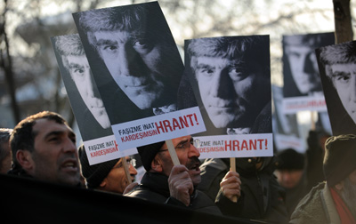 Friends of slain Turkish-Armenian journalist protest outside a courthouse in Istanbul today. (AFP/Bulent Kilic)